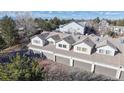 Aerial view of townhomes with attached garages and well-maintained landscaping at 12327 E Tennessee Dr # 107, Aurora, CO 80012