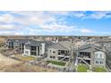 Residential neighborhood aerial view features backyard spaces and mountain views in the distance at 7242 Canyon Sky Trl, Castle Pines, CO 80108