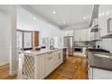 Well-designed kitchen with quartz countertops, stainless steel appliances, and wine rack island at 1016 31St St, Denver, CO 80205
