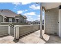 A covered patio offers serene views of the surrounding neighborhood and blue skies at 23743 E Ida Pl # E, Aurora, CO 80016