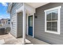 A charming entrance with a blue door and white trim offers a warm welcome at 23743 E Ida Pl # E, Aurora, CO 80016