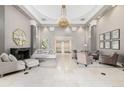 Elegant lobby with chandelier, seating area, and fireplace at 475 W 12Th Ave # 6B, Denver, CO 80204