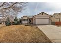 Inviting single-Gathering home featuring a bay window, attached two-car garage, and a well-manicured front lawn at 2132 Boise Ct, Longmont, CO 80504