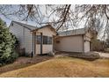 Cozy home featuring neutral siding, a two-car garage, and a bay window, set on a well-maintained lot at 2132 Boise Ct, Longmont, CO 80504