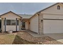 A charming single-Gathering home features manicured landscaping and a welcoming front entrance at 2132 Boise Ct, Longmont, CO 80504