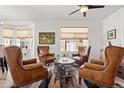 Cozy living room featuring leather armchairs and a coffee table, ideal for relaxation at 13739 Legend Trl # 102, Broomfield, CO 80023