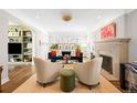 Elegant living room boasts a fireplace, plush seating, and a seamless blend of classic and modern design elements at 2020 E 4Th Ave, Denver, CO 80206