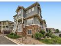 Eye-catching condo with stone accents, private balconies, and meticulously maintained landscaping at 9363 Amison Cir # 106, Parker, CO 80134
