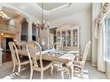 Formal dining room with a decorative chandelier and classic furnishings at 16302 Parkside Dr, Parker, CO 80134