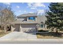 Charming home features a three-car garage, well-maintained landscaping, and an inviting facade that is sure to impress visitors at 16302 Parkside Dr, Parker, CO 80134