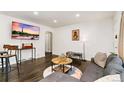 Open-concept living room featuring hardwood floors, recessed lighting, and stylish furnishings, creating an inviting atmosphere at 739 S Utica St, Denver, CO 80219