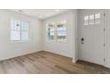 Bright entryway with white walls, luxury vinyl plank flooring and plenty of natural light at 455 S Salida St, Aurora, CO 80017