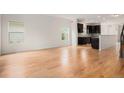 Spacious living room featuring hardwood floors and an open concept layout with easy access to the kitchen at 2935 S Sherman St, Englewood, CO 80113