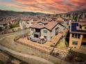 Stunning home featuring a spacious deck, perfect for outdoor entertaining with great sunset views at 15230 W Baker Ave, Lakewood, CO 80228