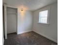 Bright bedroom with a built-in closet and window, offering a cozy and functional space at 2429 S Cherokee St, Denver, CO 80223