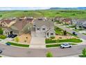 An aerial shot of a lovely home in a well-planned neighborhood and mountain view at 19316 W 84Th Pl, Arvada, CO 80007