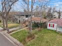 An aerial view of the charming brick home with a landscaped yard at 1665 S Saint Paul St, Denver, CO 80210