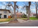 Charming brick home featuring a landscaped front yard and inviting walkway at 1665 S Saint Paul St, Denver, CO 80210