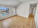 Bright living room featuring hardwood floors and vaulted ceiling at 4169 S Lewiston St, Aurora, CO 80013