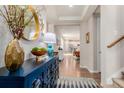 Elegant foyer with stylish console table, decorative mirror, and an open view into the living spaces at 9456 E 51St Dr, Denver, CO 80238