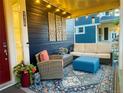 Inviting front porch featuring comfortable seating, stylish decor, and a relaxing atmosphere at 9456 E 51St Dr, Denver, CO 80238
