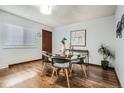 Cozy dining area with modern table and chairs near a window offering natural light at 444 Vance St, Lakewood, CO 80226