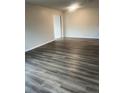 Bright and airy living room features new flooring and fresh paint at 9762 Appletree Pl, Thornton, CO 80260