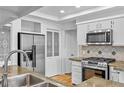 Updated kitchen with stainless steel appliances and granite counters at 900 Ballantine Rd, Golden, CO 80401