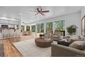 Open concept living room with hardwood floors, large windows, and modern furnishings at 900 Ballantine Rd, Golden, CO 80401
