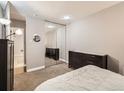 Bright bedroom featuring a mirrored closet and neutral tones for a serene and spacious feel at 1050 N Corona St # 105, Denver, CO 80218