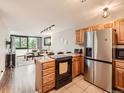 Open-concept space featuring a fully equipped kitchen flowing into a cozy living area with large windows at 1050 N Corona St # 105, Denver, CO 80218