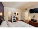 Cozy main bedroom with hardwood floors, ensuite bathroom, and a walk-in closet at 2430 W 82Nd Pl # 2F, Westminster, CO 80031