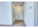 The entryway is well lit with neutral walls and transition flooring at 7260 S Gaylord St # E26, Littleton, CO 80122