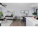 Modern living and dining area with contemporary furnishings and stylish decor at 1109 Ash Ct, Fort Lupton, CO 80621