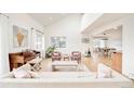 Open-concept living room boasts vaulted ceilings, a piano, and lots of natural light at 3970 Longwood Ave, Boulder, CO 80305