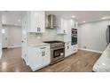 Modern kitchen featuring white cabinets, stainless steel appliances, and granite countertops at 6635 S Sherman St, Centennial, CO 80121