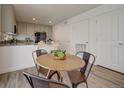 Kitchen dining area with wood table and metal chairs at 10317 Vaughn Way, Commerce City, CO 80022