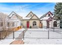 Curb appeal abounds in this snow-covered neighborhood at 1342 Lipan St, Denver, CO 80204