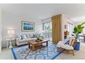 Comfortable living room with a decorative rug, leading to a cozy balcony at 620 S Alton Way # 5B, Denver, CO 80247