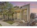 Charming home exterior displaying a covered front porch, neat landscaping, and neutral tones at 11153 W 17Th Ave # 101, Lakewood, CO 80215