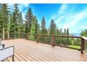 Spacious deck with stunning mountain views, perfect for outdoor relaxation and entertaining with room for outdoor furniture at 1176 Raven Ridge Rd, Idaho Springs, CO 80452