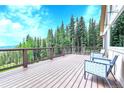Spacious deck featuring stylish seating, perfect for enjoying the surrounding views of the beautiful forest at 1176 Raven Ridge Rd, Idaho Springs, CO 80452