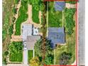 Aerial view of the home showing its layout, yard, and proximity to the street at 1901 S Adams St, Denver, CO 80210
