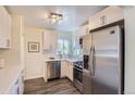 Modern kitchen features stainless steel appliances and bright white cabinetry at 1901 S Adams St, Denver, CO 80210