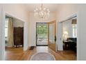 Elegant foyer with a chandelier and an ornate front door at 728 N Ogden St, Denver, CO 80218