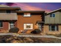 Charming townhome with brick facade and well-maintained landscaping at 8624 Mariposa St, Thornton, CO 80260