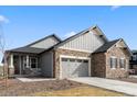 Charming single-Gathering home with stone and siding exterior, a two-car garage, and a well-manicured lawn at 17233 W 93Rd Pl, Arvada, CO 80007
