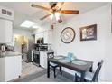 Bright kitchen with modern appliances and eat-in dining area at 1845 Kendall St # 325D, Denver, CO 80214