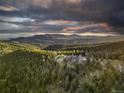 Mountaintop home with expansive views of the surrounding landscape at 26271 Richmond Hill Rd, Conifer, CO 80433