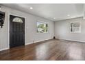 Inviting living room featuring hardwood floors, natural light, and neutral paint, perfect for entertaining at 765 Iola St, Aurora, CO 80010